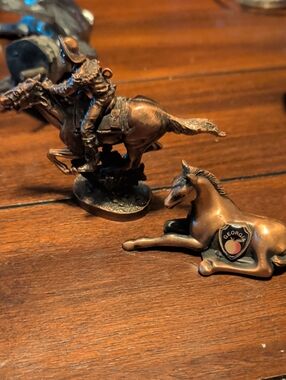 Hallmark metallic copper-toned circular emblem